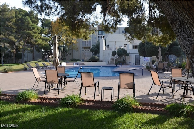 view of pool featuring a patio area