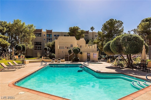 view of swimming pool featuring a patio