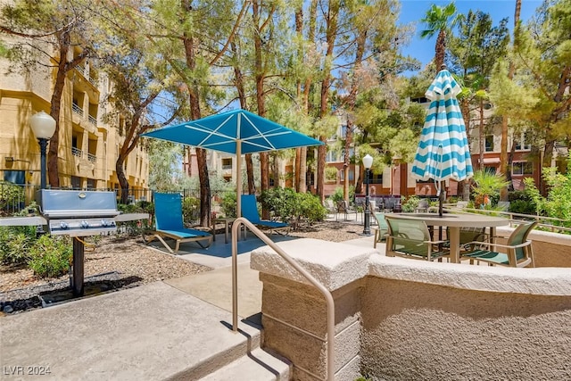 view of playground with a patio