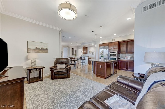 living room featuring ornamental molding, visible vents, and recessed lighting