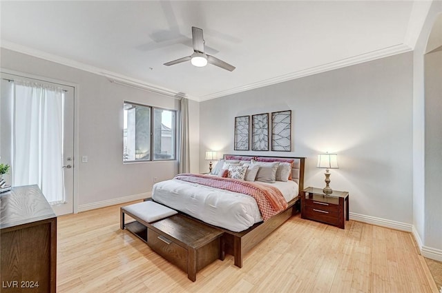 bedroom with a ceiling fan, baseboards, crown molding, and light wood-style floors