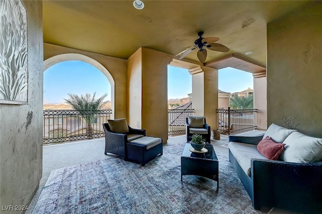 view of patio with outdoor lounge area, a ceiling fan, and a balcony