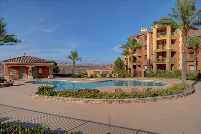 community pool featuring a mountain view