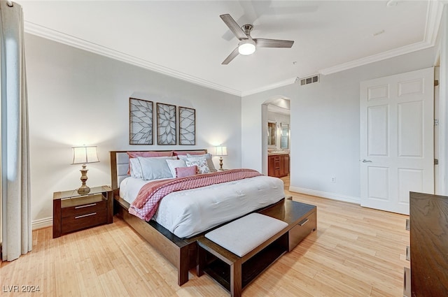 bedroom with light wood-type flooring, crown molding, connected bathroom, and ceiling fan