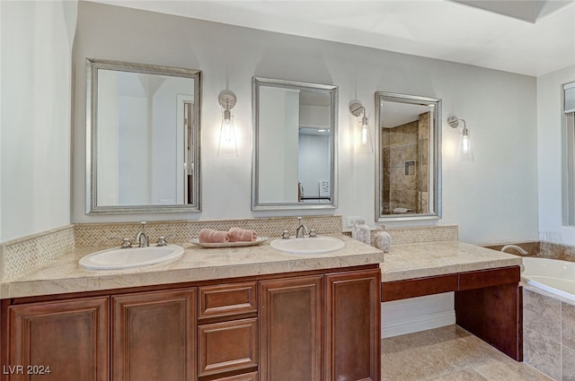 bathroom with vanity and independent shower and bath