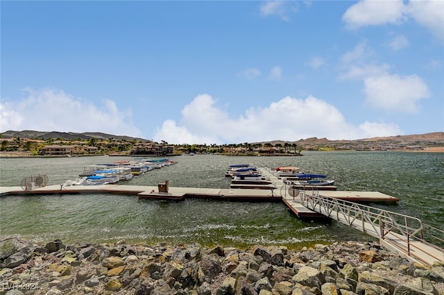 view of dock featuring a water and mountain view