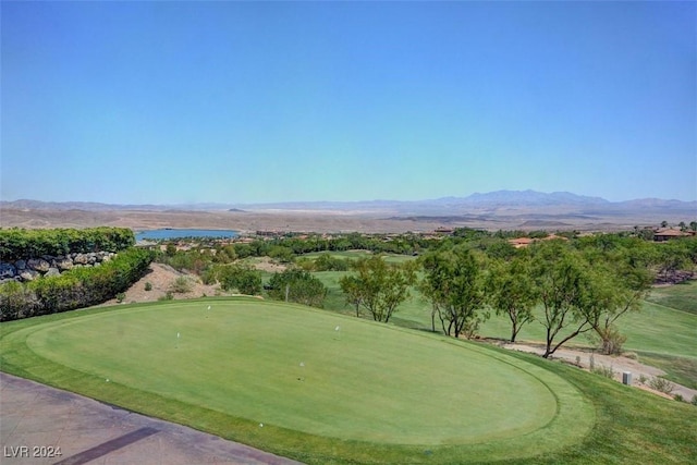 view of community featuring view of golf course and a mountain view