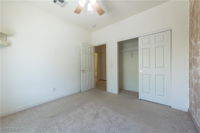 unfurnished bedroom with a closet, visible vents, baseboards, and carpet floors