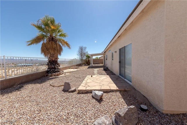 view of yard featuring a patio and a fenced backyard