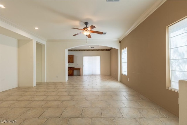 spare room with visible vents, recessed lighting, arched walkways, ornamental molding, and ceiling fan