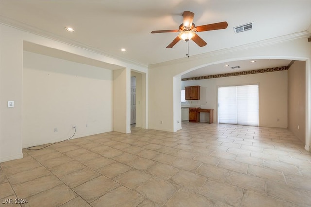 unfurnished room with arched walkways, visible vents, crown molding, and a ceiling fan