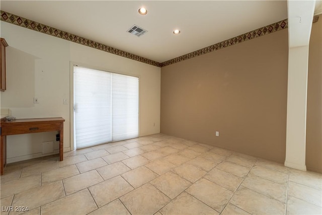 unfurnished room with recessed lighting and visible vents