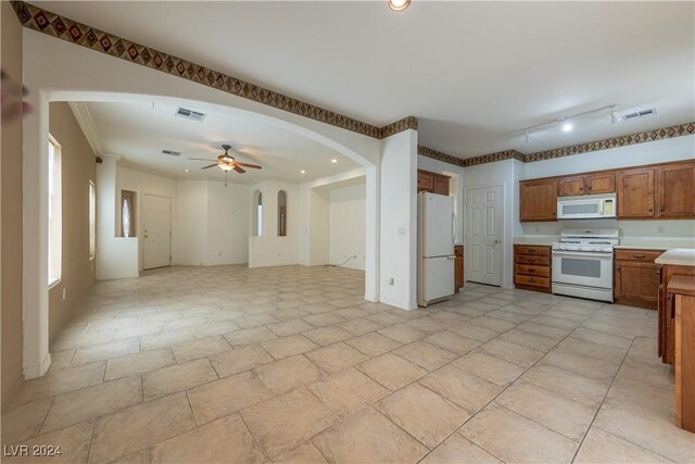 kitchen featuring ornamental molding, white appliances, and ceiling fan