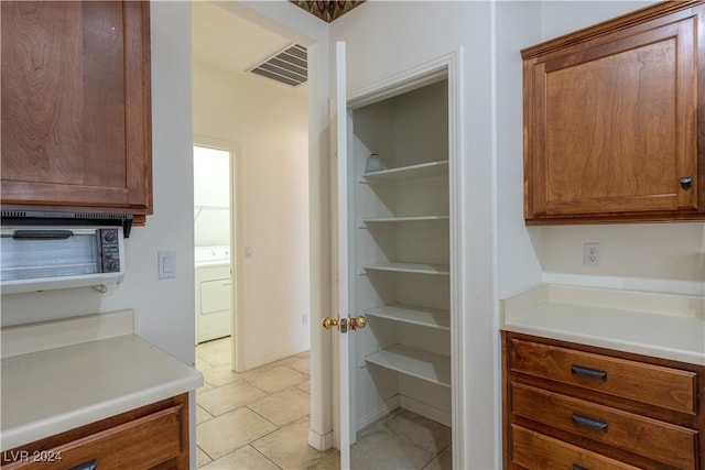 pantry featuring visible vents and washer / clothes dryer