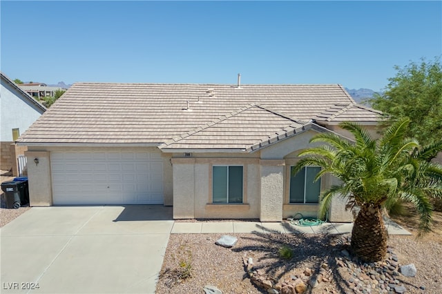 ranch-style home featuring a garage