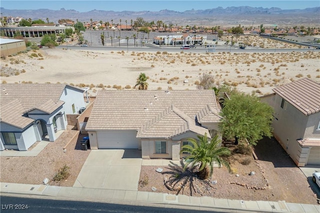 birds eye view of property with a mountain view and a residential view