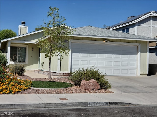 single story home featuring a garage