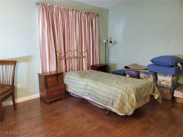 bedroom featuring wood-type flooring