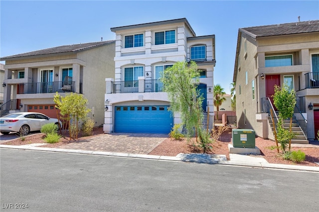 view of front of property with a balcony and a garage