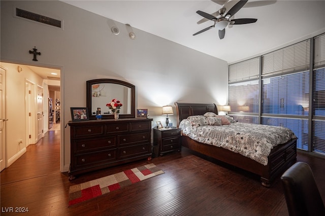 bedroom with ceiling fan and dark wood-type flooring