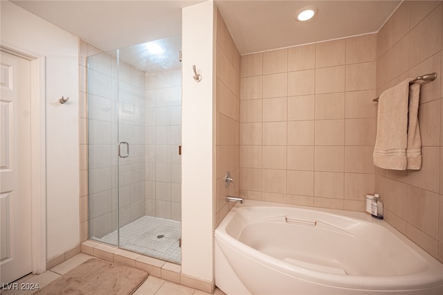 bathroom featuring plus walk in shower and tile patterned floors