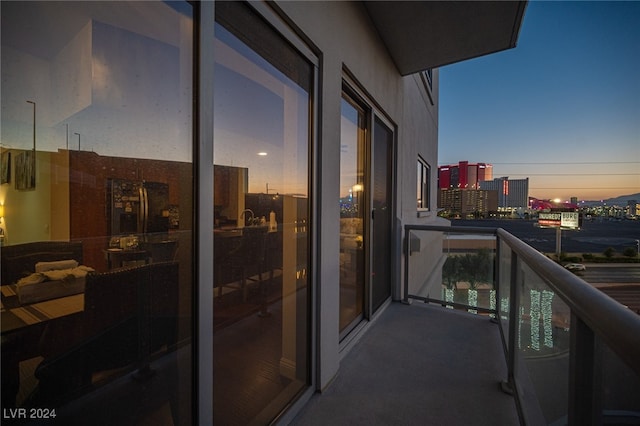 view of balcony at dusk