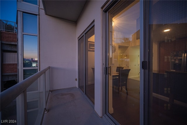 view of balcony at dusk