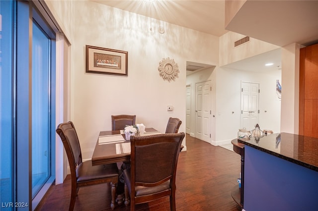 dining space featuring dark wood-type flooring