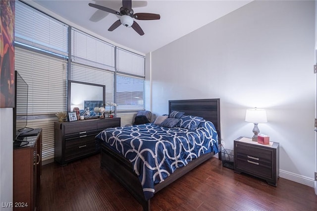 bedroom with wood finished floors, baseboards, and ceiling fan