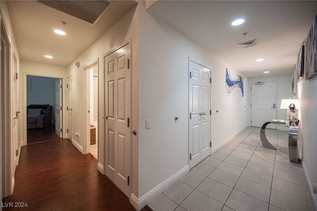 hall with light hardwood / wood-style floors