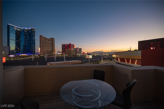 view of balcony at dusk