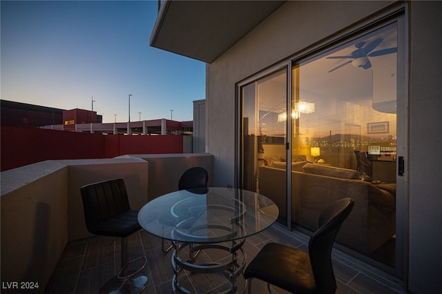 view of balcony at dusk