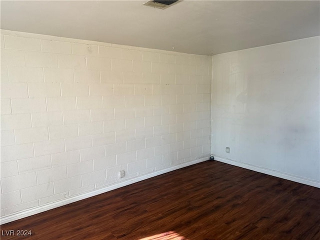 unfurnished room featuring dark hardwood / wood-style floors