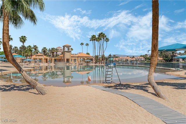 view of pool with a water view