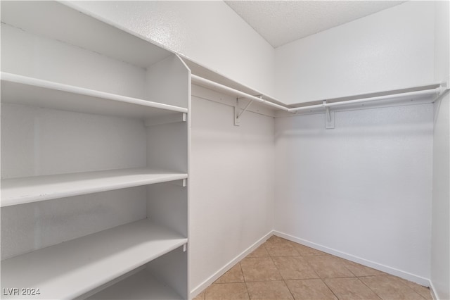 walk in closet featuring light tile patterned floors