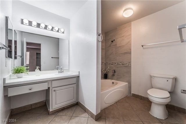 full bathroom with tile patterned floors, vanity, toilet, and tiled shower / bath