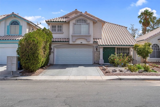 view of front of property featuring a garage