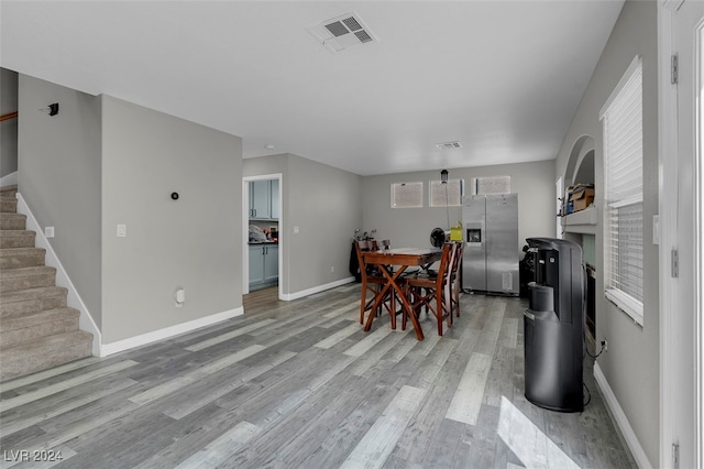 dining space featuring light wood-type flooring