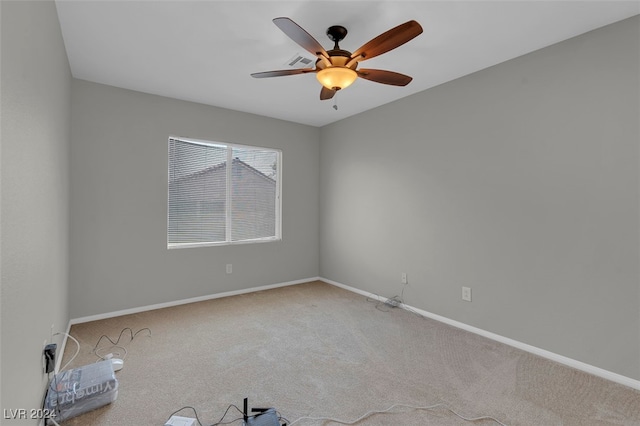 unfurnished room with ceiling fan and carpet flooring