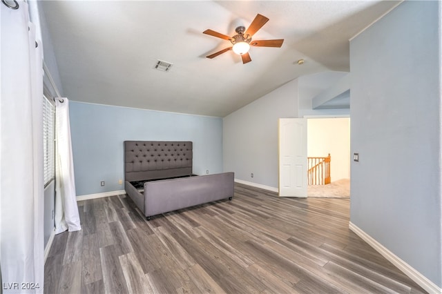 sitting room with wood-type flooring, vaulted ceiling, and ceiling fan