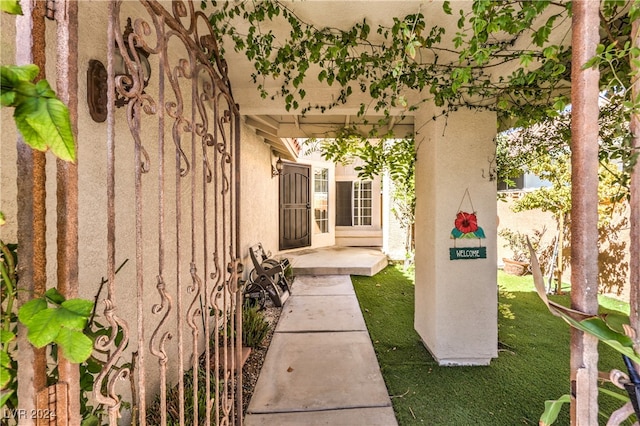 entrance to property with a yard