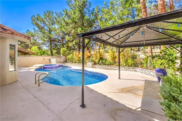 view of pool featuring an in ground hot tub, a patio area, and a gazebo