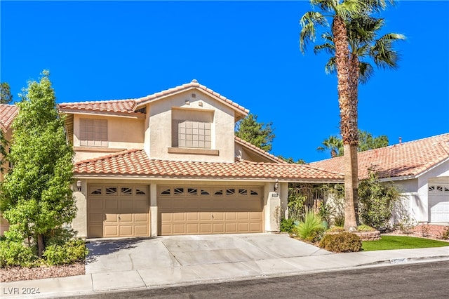 mediterranean / spanish house featuring a garage