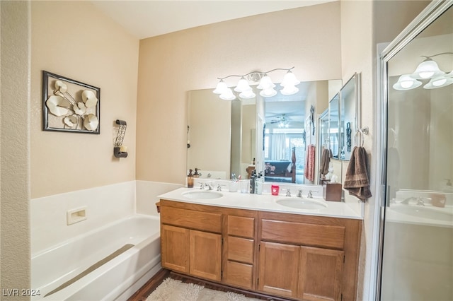 bathroom with vanity and separate shower and tub