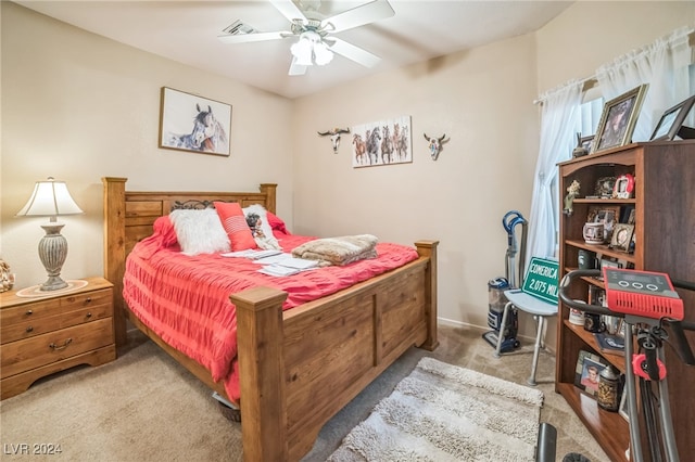 bedroom with ceiling fan and light colored carpet