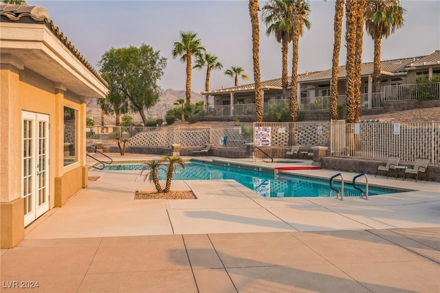 view of swimming pool with a patio