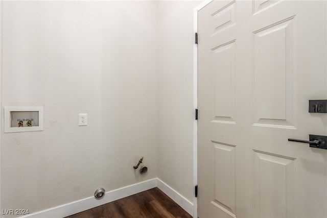 clothes washing area featuring gas dryer hookup, hookup for a washing machine, and dark hardwood / wood-style flooring