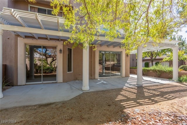 back of house featuring a pergola and a patio area