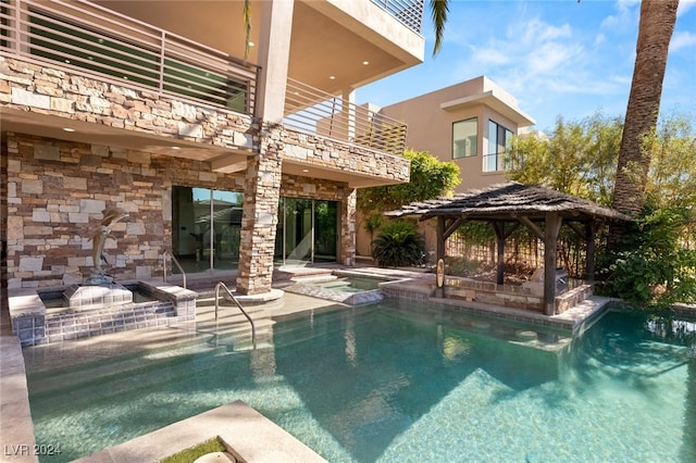 view of pool with a patio area and a gazebo