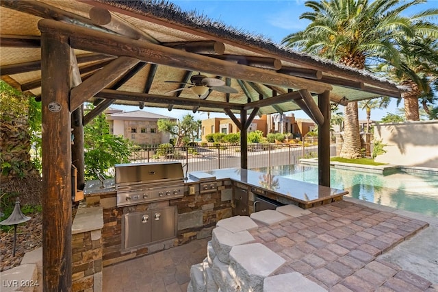 view of patio / terrace with a grill, a gazebo, area for grilling, a fenced in pool, and ceiling fan